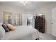 Comfortable bedroom featuring a large window, carpet, and a six-drawer dresser at 10764 70Th Ave # 1205, Seminole, FL 33772