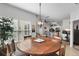 Open concept living space featuring a dining room leading to a modern kitchen with a breakfast bar at 10764 70Th Ave # 1205, Seminole, FL 33772