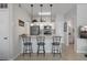 Kitchen with granite counters, pendant lights, stainless steel appliances and bar stool seating at counter at 10764 70Th Ave # 1205, Seminole, FL 33772