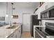 Kitchen features stainless steel appliances, a breakfast bar, pendant lighting and granite countertops at 10764 70Th Ave # 1205, Seminole, FL 33772