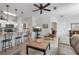 Living room has an eat-in bar area and leads to the dining area and bedrooms through white doors at 10764 70Th Ave # 1205, Seminole, FL 33772