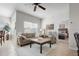 Comfortable living room offers tile floors, a ceiling fan, and a view into the carpeted main bedroom at 10764 70Th Ave # 1205, Seminole, FL 33772