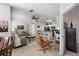 Open-concept living space with a ceiling fan, tile floors and dining room access at 10764 70Th Ave # 1205, Seminole, FL 33772