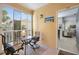 Enclosed patio with seating area and view of the community at 10764 70Th Ave # 1205, Seminole, FL 33772