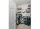 Walk-in closet with shelving and hanging racks for organized storage, and carpet floors for comfort at 10764 70Th Ave # 1205, Seminole, FL 33772