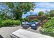 Backyard deck with outdoor seating and decorative plants creating an ideal outdoor living space at 12116 N 52Nd St, Temple Terrace, FL 33617