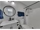 Well-lit bathroom with walk-in shower, sleek black hardware, and a modern vanity at 12116 N 52Nd St, Temple Terrace, FL 33617