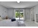 This bedroom is spacious with sliding glass doors leading to the lush outdoors at 12116 N 52Nd St, Temple Terrace, FL 33617