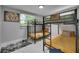 Bedroom featuring unique bunk beds and natural light from the bright window at 12116 N 52Nd St, Temple Terrace, FL 33617
