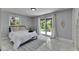 Bright bedroom featuring a sliding glass door to the outside and clean, white decor at 12116 N 52Nd St, Temple Terrace, FL 33617