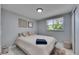 Cozy bedroom featuring plush shag rug and window with a view of mature trees at 12116 N 52Nd St, Temple Terrace, FL 33617