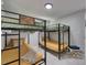 Bright bunk room offers 2 sets of sturdy bunk beds with matching yellow linens at 12116 N 52Nd St, Temple Terrace, FL 33617