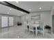 Bright dining room with modern white chairs and lovely décor at 12116 N 52Nd St, Temple Terrace, FL 33617