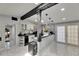 Bright kitchen features a skylight, pendant lighting, and bar top that opens to the dining area at 12116 N 52Nd St, Temple Terrace, FL 33617