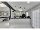 Modern kitchen with black appliances, white cabinets, and marble floors at 12116 N 52Nd St, Temple Terrace, FL 33617