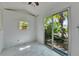 Bright living space with white walls, marble floors, and sliding glass door to backyard oasis at 12116 N 52Nd St, Temple Terrace, FL 33617
