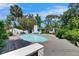 Inviting backyard pool with wooden deck surround and lush landscaping at 12116 N 52Nd St, Temple Terrace, FL 33617
