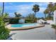 Lovely pool with deck surrounded by a concrete patio, landscaping and a privacy fence at 12116 N 52Nd St, Temple Terrace, FL 33617