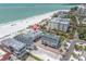 Aerial view of property close to a beach with white sand, and a calm ocean at 12274 1St W St # 2, Treasure Island, FL 33706