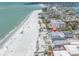Stunning aerial view of beachfront property with direct access to the white sands and ocean waters at 12274 1St W St # 2, Treasure Island, FL 33706