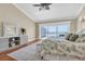 Bedroom showcasing sliding doors with ocean views, floral bedding, hardwood floors, and light decor at 12274 1St W St # 2, Treasure Island, FL 33706