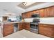 Well-appointed kitchen with granite countertops, stainless steel appliances, and ample cabinet space at 12274 1St W St # 2, Treasure Island, FL 33706