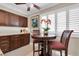 Cozy breakfast nook with dark wood cabinets and natural light from window at 12274 1St W St # 2, Treasure Island, FL 33706