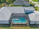 Aerial view of the property highlighting the screened-in pool, spacious backyard, and well-maintained landscaping at 12546 Wildebeest Way, Spring Hill, FL 34610