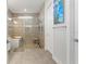 Bright bathroom featuring a modern soaking tub, glass shower, and stylish tile work at 12546 Wildebeest Way, Spring Hill, FL 34610