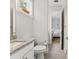 Well-lit bathroom with granite countertop and a view into the bedroom at 12546 Wildebeest Way, Spring Hill, FL 34610