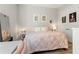 Bedroom featuring bright walls and a comfortable bed with decorative pillows at 12546 Wildebeest Way, Spring Hill, FL 34610