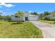 Charming single-story home with a well-manicured lawn and inviting curb appeal under blue skies at 12546 Wildebeest Way, Spring Hill, FL 34610