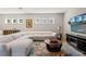 Bright living room featuring a comfortable sectional sofa, stylish decor, and natural light at 12546 Wildebeest Way, Spring Hill, FL 34610