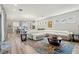 Living room features a large sectional sofa, open floor plan, and ample natural light at 12546 Wildebeest Way, Spring Hill, FL 34610