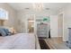 Elegant bedroom with ensuite bathroom, art, and modern chandelier at 12546 Wildebeest Way, Spring Hill, FL 34610