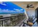 Balcony with chairs overlooking a beautiful beach at 1270 Gulf Blvd # 501, Clearwater Beach, FL 33767
