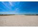 Expansive white sand beach under a clear blue sky, perfect for relaxation and recreation at 1270 Gulf Blvd # 501, Clearwater Beach, FL 33767
