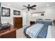 Inviting bedroom featuring a ceiling fan, bed with striped bedding, and stylish decor at 1270 Gulf Blvd # 501, Clearwater Beach, FL 33767