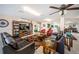 Comfortable common room with dark leather couches, red chairs, and a cozy rug at 1270 Gulf Blvd # 501, Clearwater Beach, FL 33767