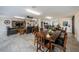Inviting common room with dark wooden tables and chairs and tile flooring at 1270 Gulf Blvd # 501, Clearwater Beach, FL 33767