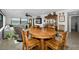 Inviting dining area features a wooden table set, beach view, and access to comfortable living space at 1270 Gulf Blvd # 501, Clearwater Beach, FL 33767