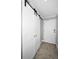 Hallway featuring a coat closet with sliding doors and a gray front door at 1270 Gulf Blvd # 501, Clearwater Beach, FL 33767