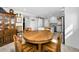 Bright kitchen offers wooden table set with hutch, white cabinets and modern appliances at 1270 Gulf Blvd # 501, Clearwater Beach, FL 33767