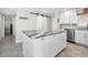 Kitchen island featuring marble countertop, modern cabinetry, and stainless steel appliances at 1270 Gulf Blvd # 501, Clearwater Beach, FL 33767