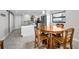 Open kitchen with white cabinets, stainless appliances and adjacent breakfast nook at 1270 Gulf Blvd # 501, Clearwater Beach, FL 33767