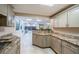 Well-equipped kitchenette featuring granite countertops and access to common areas at 1270 Gulf Blvd # 501, Clearwater Beach, FL 33767