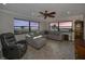 Bright living room featuring a sectional sofa, recliner, ceiling fan and stunning ocean views at 1270 Gulf Blvd # 501, Clearwater Beach, FL 33767