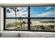 Stunning ocean view from the unit showcasing palm trees and sandy beach at 1270 Gulf Blvd # 501, Clearwater Beach, FL 33767