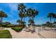 A serene walkway leads to the beach, surrounded by lush landscaping and community amenities at 1270 Gulf Blvd # 501, Clearwater Beach, FL 33767