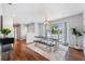 Spacious dining room with a modern table, large window, and hardwood flooring at 1414 Corner Oaks Dr, Brandon, FL 33510